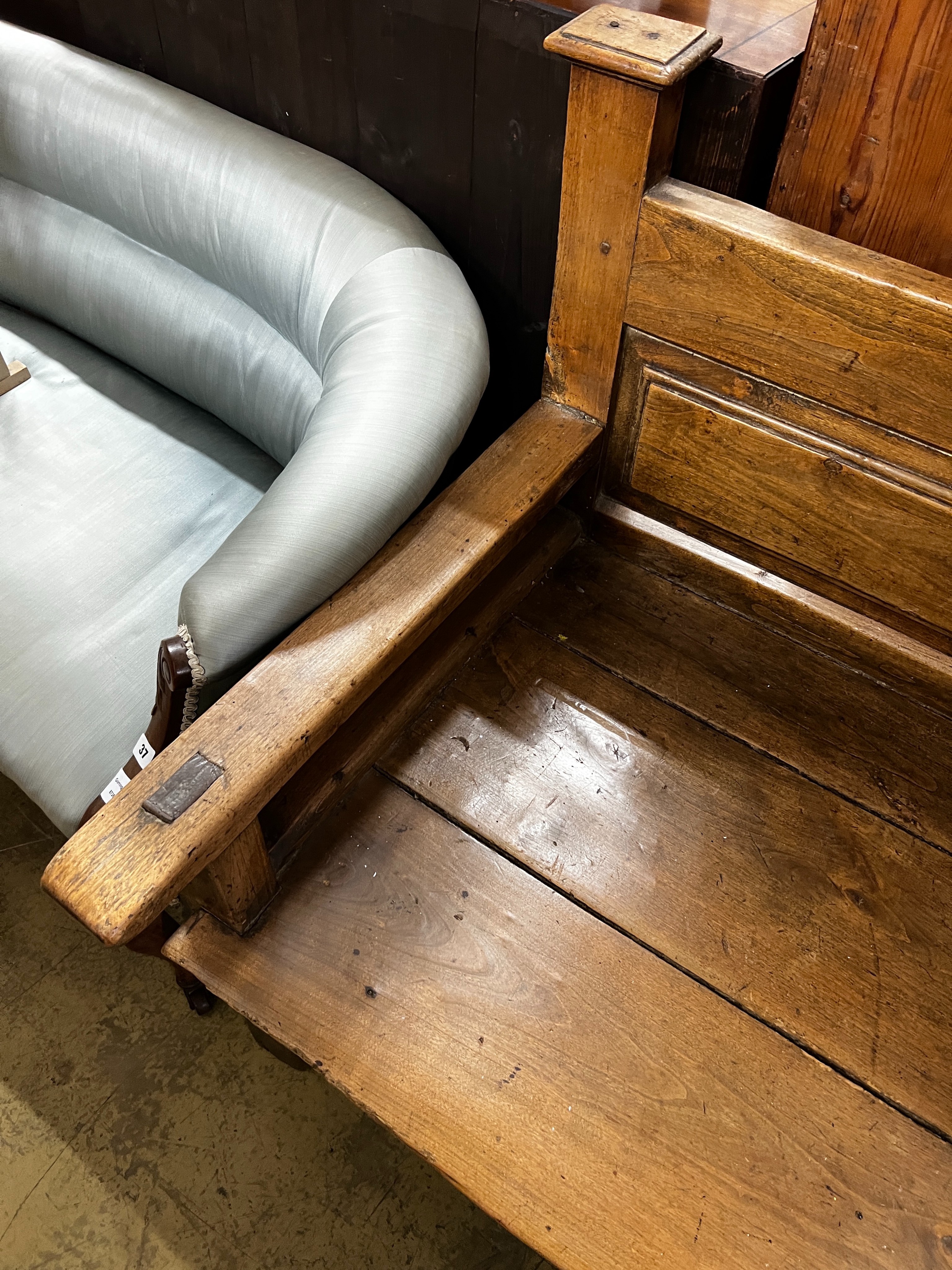 A 19th century Continental panelled settle, length 187cm, depth 70cm, height 92cm
